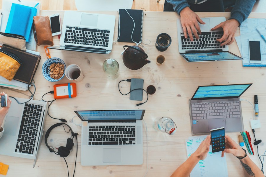 Team working across connected laptops